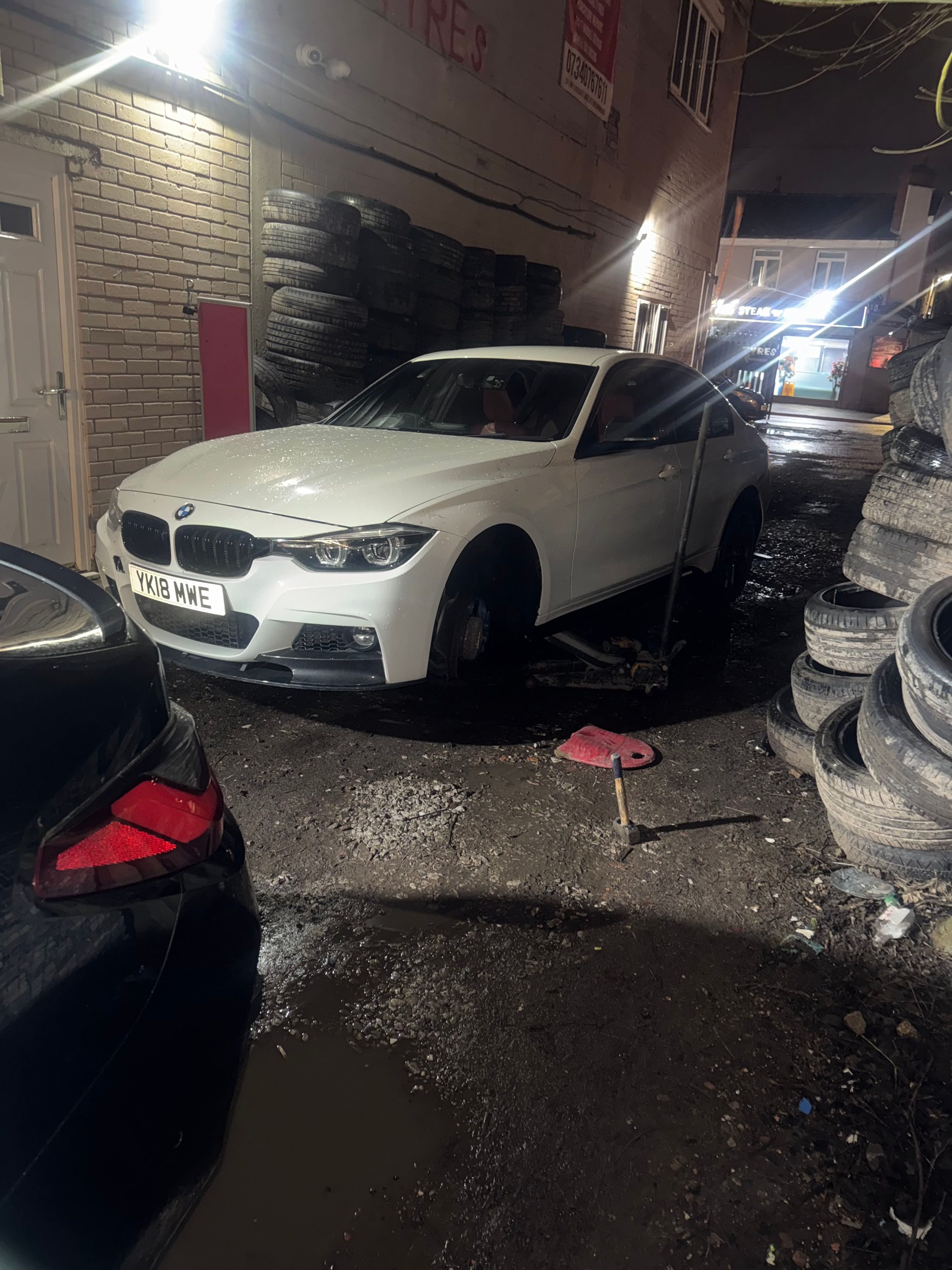 BMW being serviced at Birmingham Tyres World at night