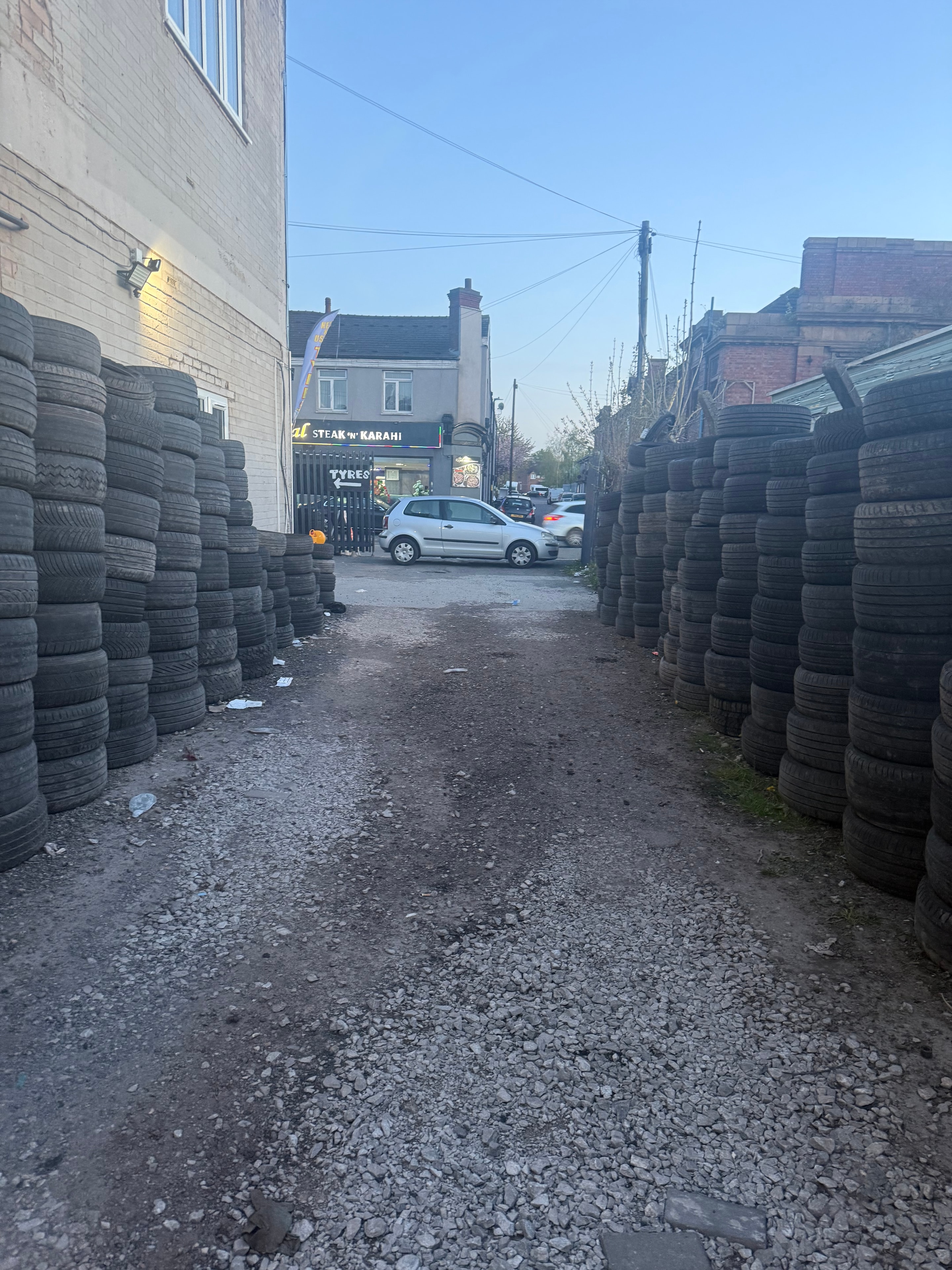 Large stock of tyres outside Birmingham Tyres World on Highgate Road